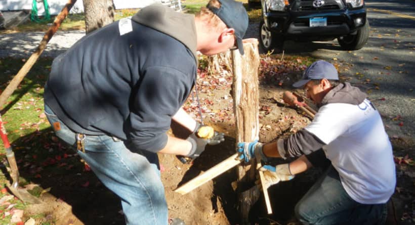 Volunteers Tim and Mike install a new mailbox post at a Charter our Community-Rebuilding Together event in New Milford, Connecticut