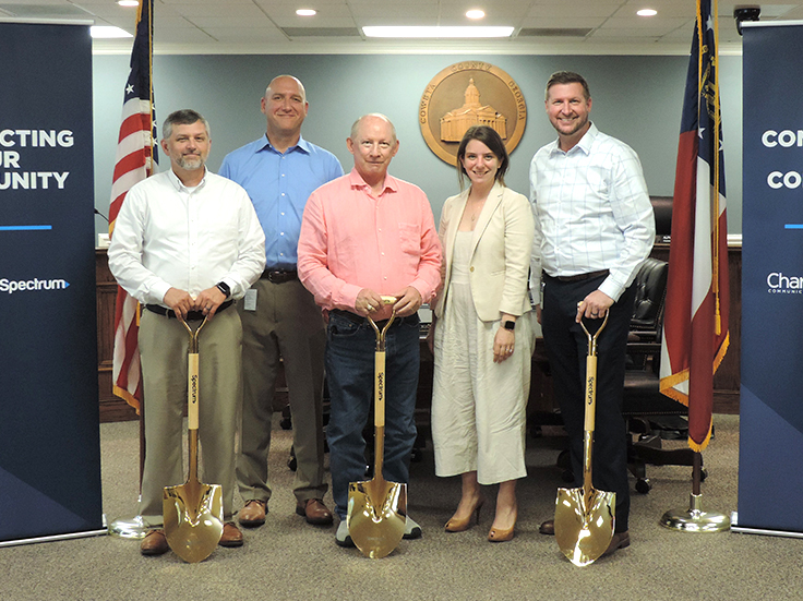 Officials pose with golden shovels for broadband expansion project in Coweta County, Ga.