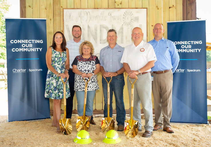 Officials pose with golden shovels for broadband expansion project in Carroll County, Ga.