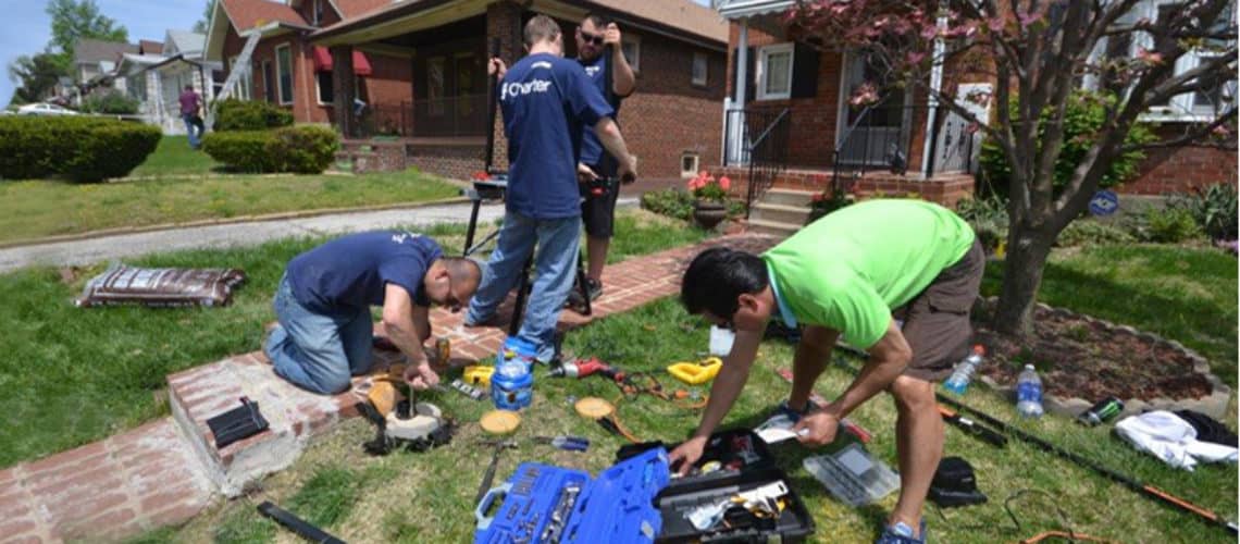 Charter Communications employees participating in a safe and healthy homes rebuilding project