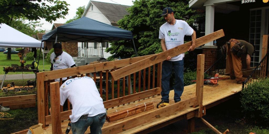 An image of Charter employees building a ramp on National Rebuilding Day. 