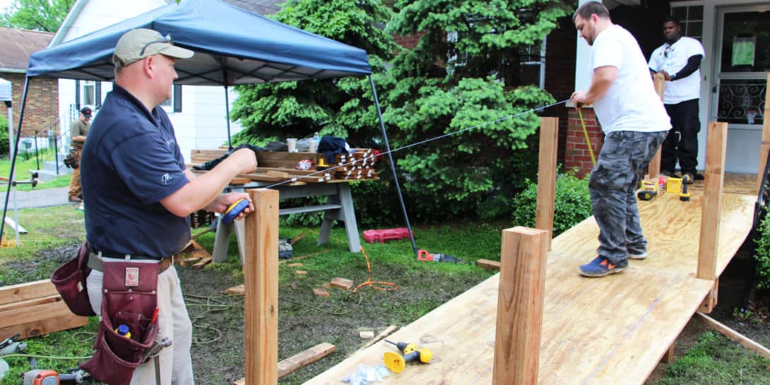 An image of Charter employees constructing a ramp on National Rebuilding Day.
