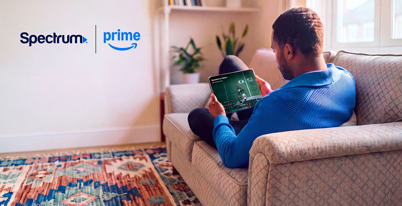 A man using a tablet on his couch