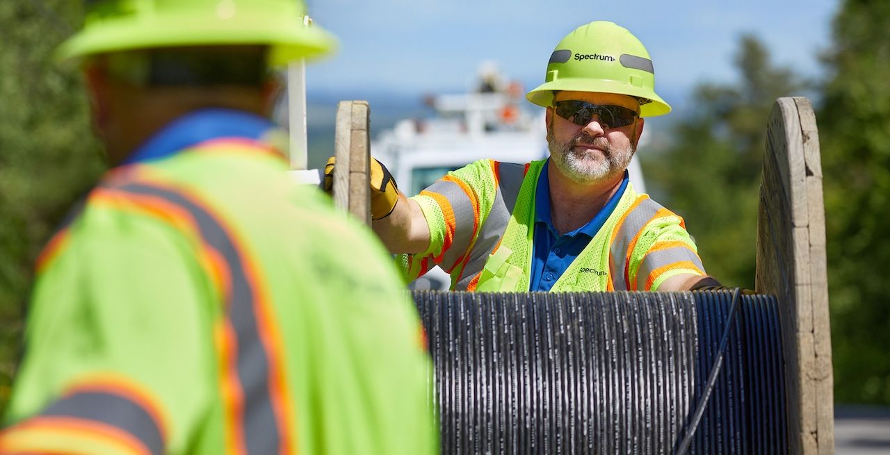 Spectrum technician crew working on a broadband expansion project