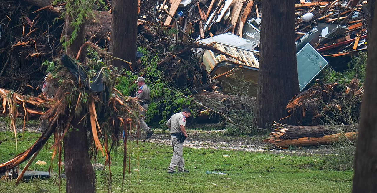 Emergency response crews examine the damage following flooding in Texas