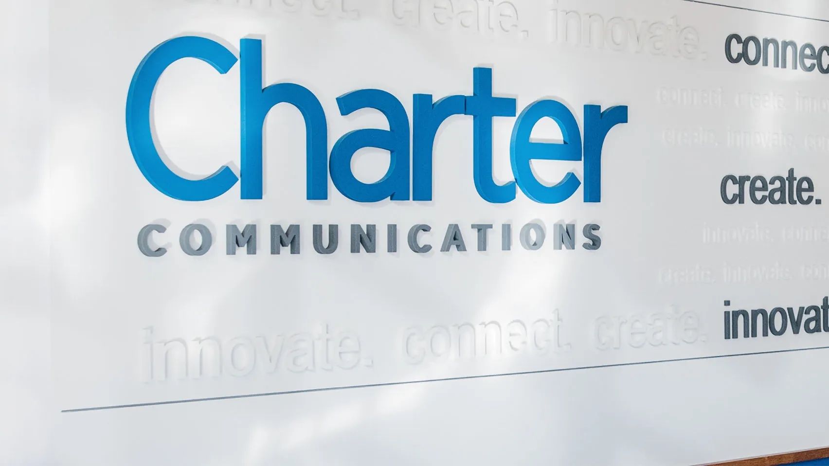 Charter logo on a wall in a corporate office