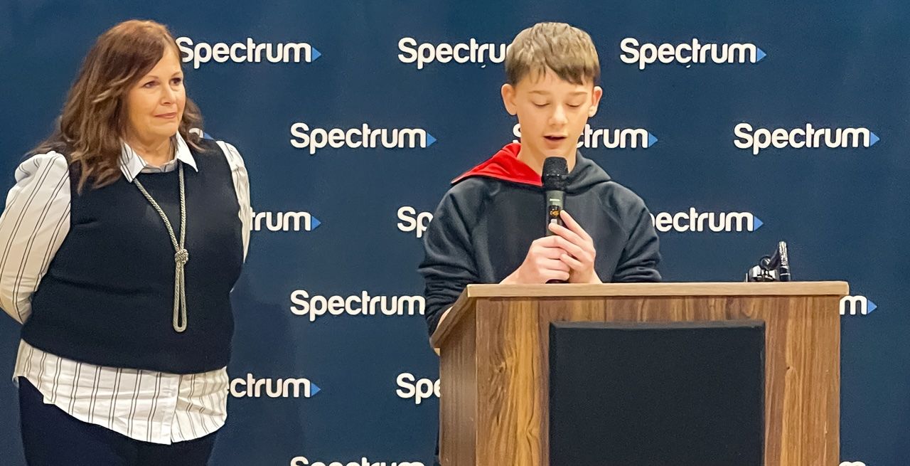 Student Jeffrey Guy speaks at a podium during an event held at the Boys & Girls Club of Elizabethton/Carter County, Tennessee.