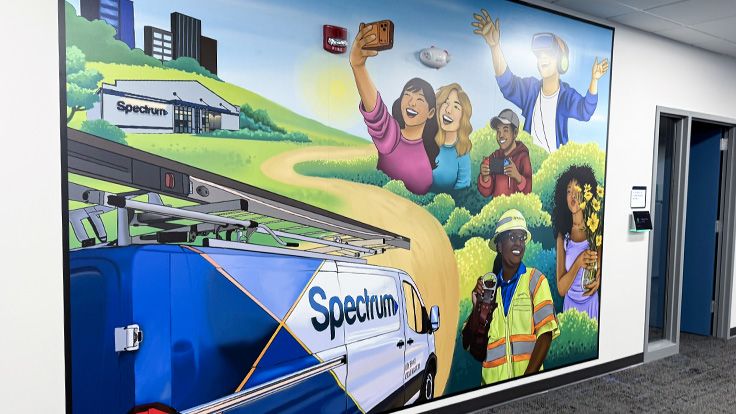 Mural of a Spectrum van and happy customers