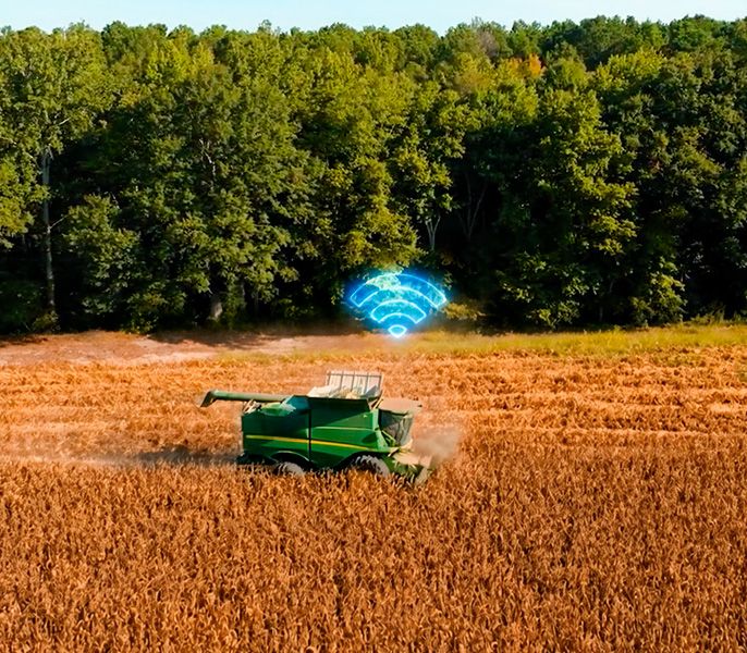 A harvester in a field with WiFi symbol 