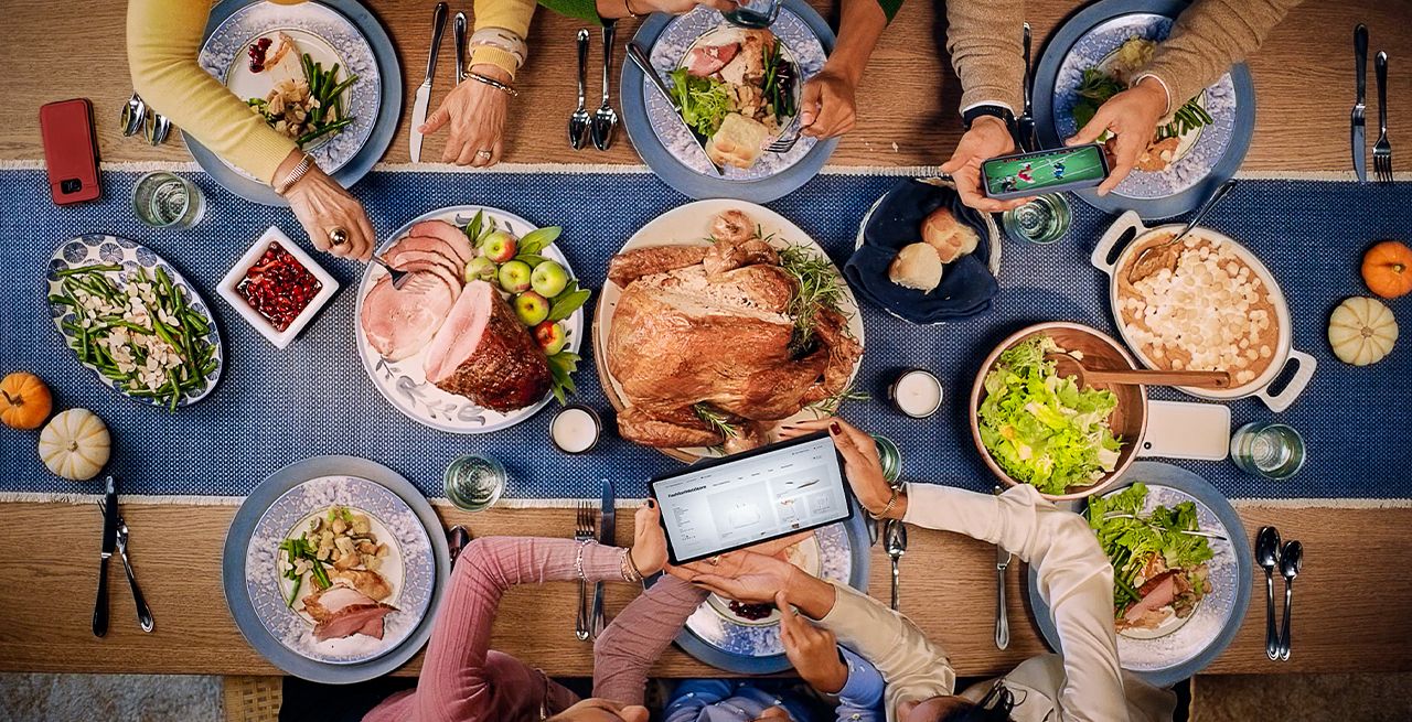 Thanksgiving table with mobile devices on the table