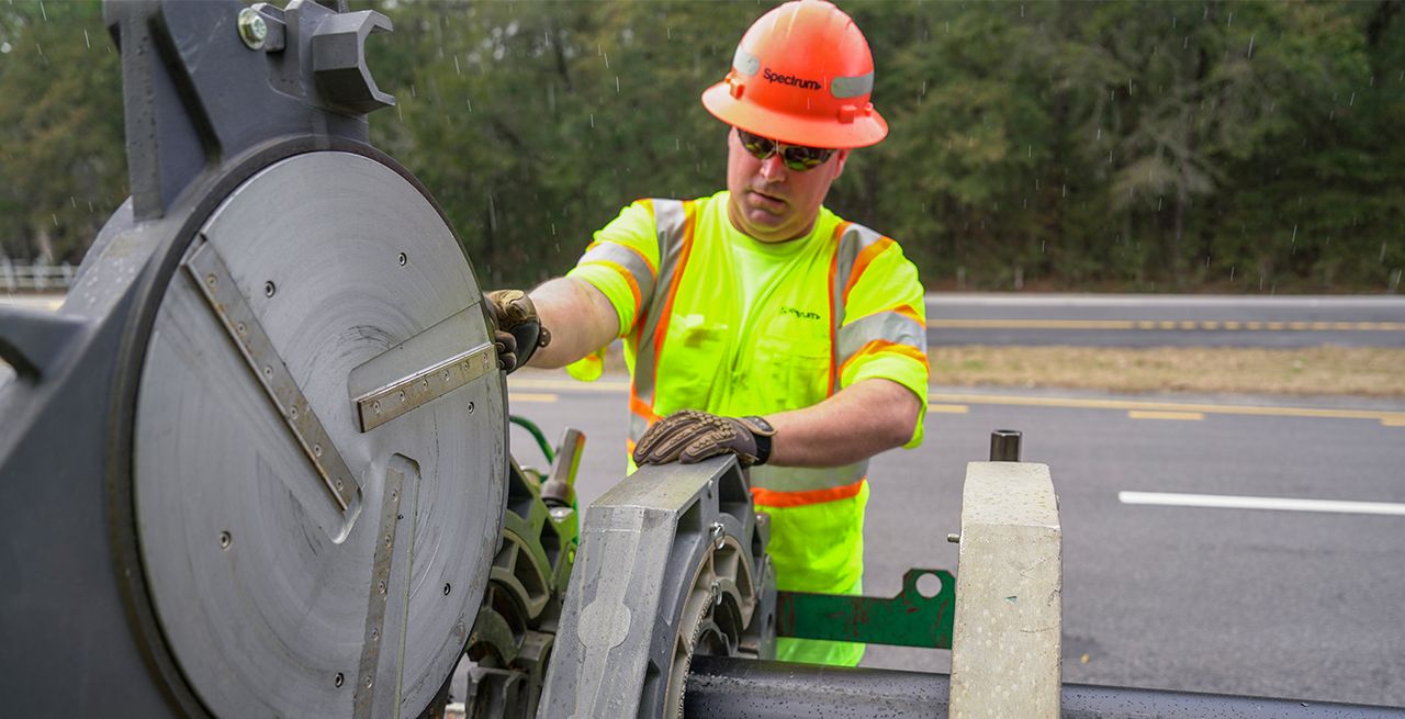 A Spectrum field technician working on a broadband expansion project 
