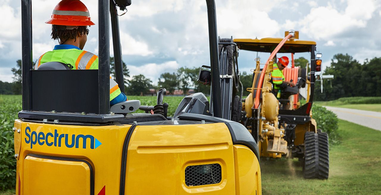 Spectrum field technicians working on a broadband expansion project