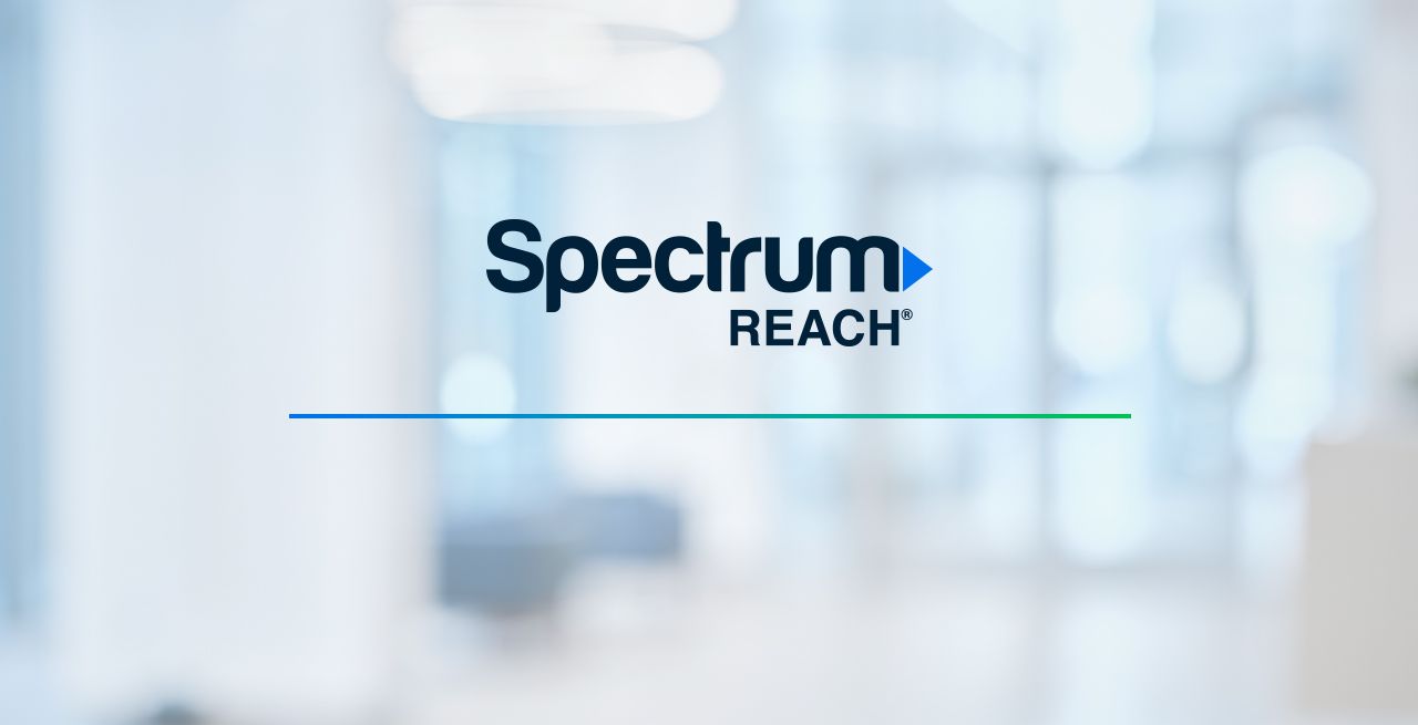 Spectrum Reach logo on a blurred background