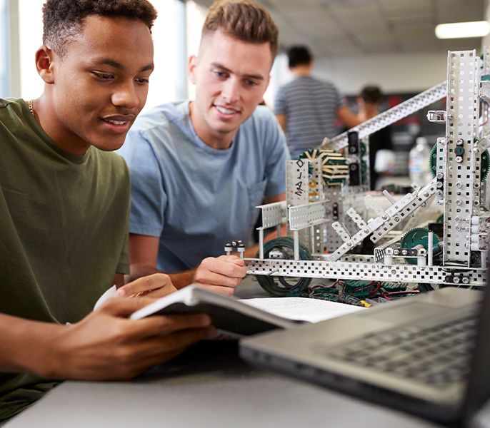 Two students working on a computer