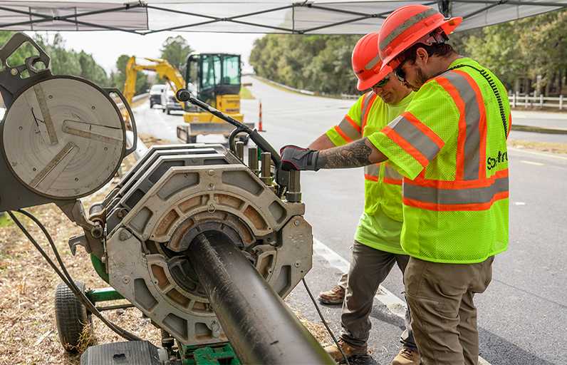 Spectrum technicians working on broadband infrastructure
