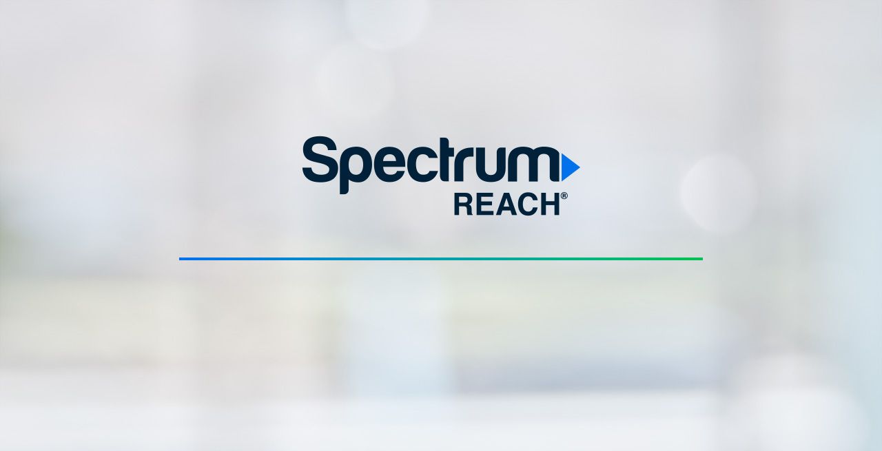 Image of Spectrum Reach logo on blurred background.