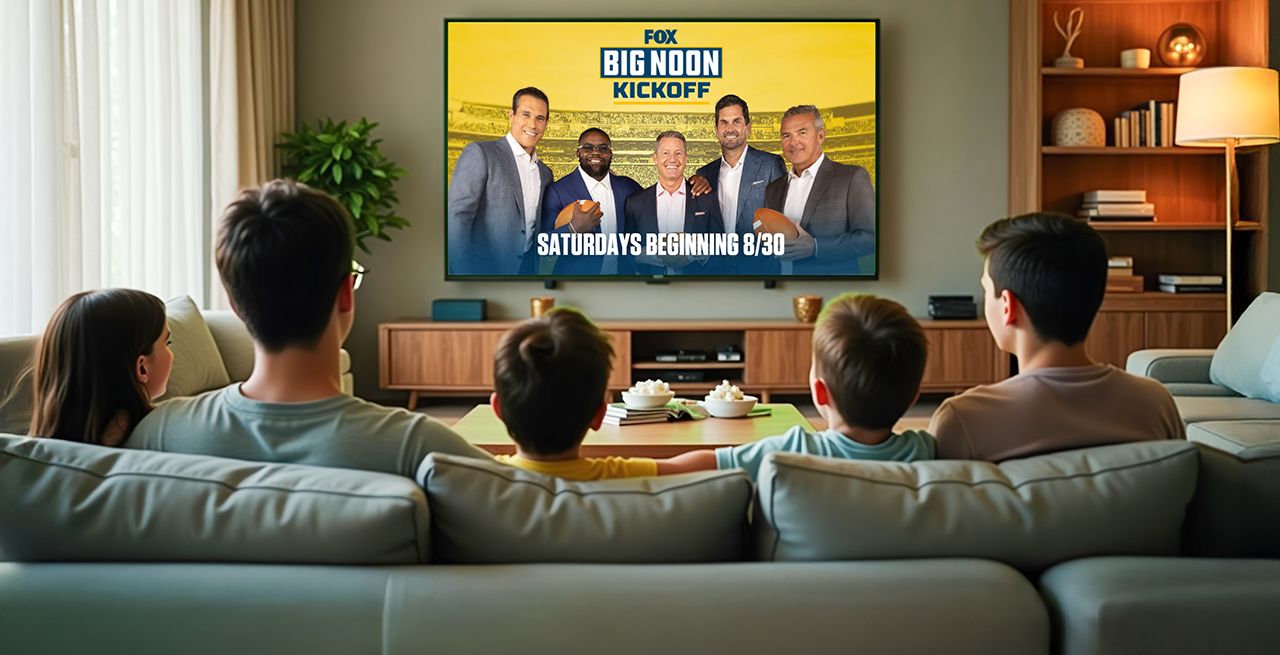 A family watching Fox One programming in their living room