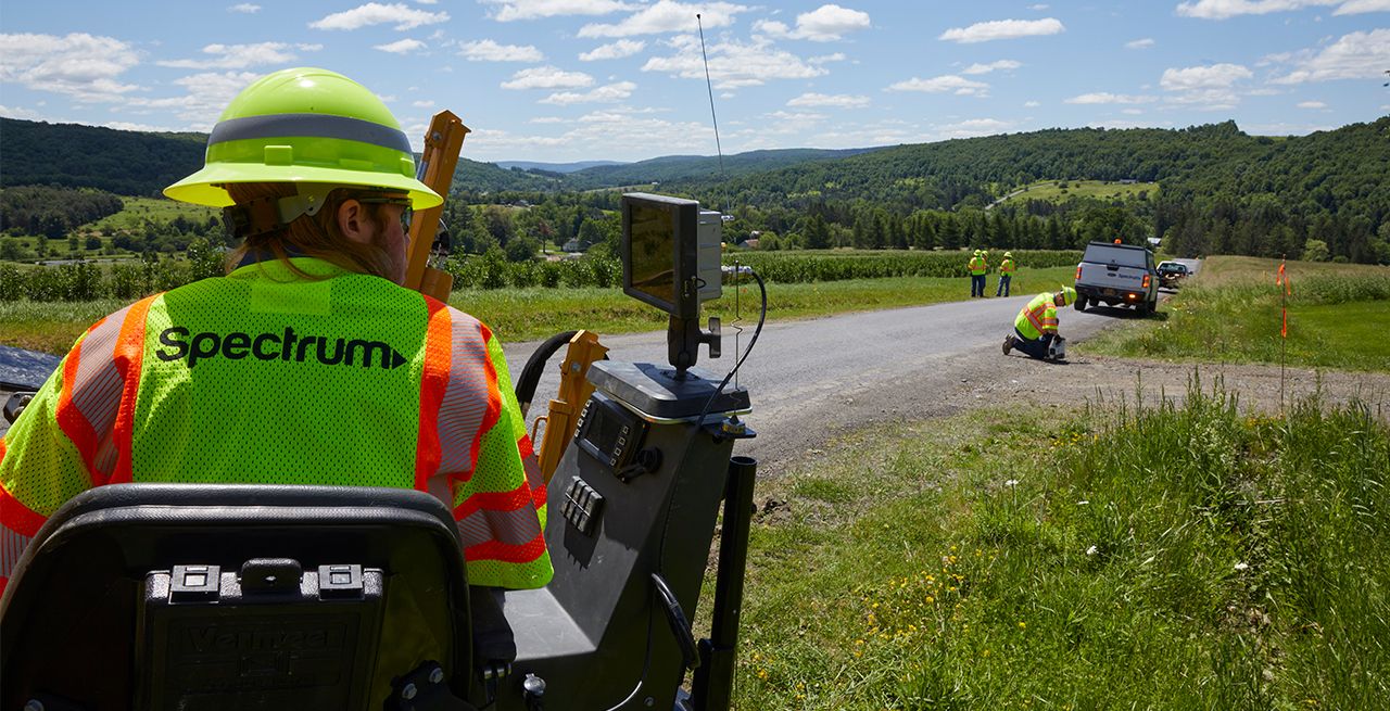 Spectrum technician working on broadband expansion project