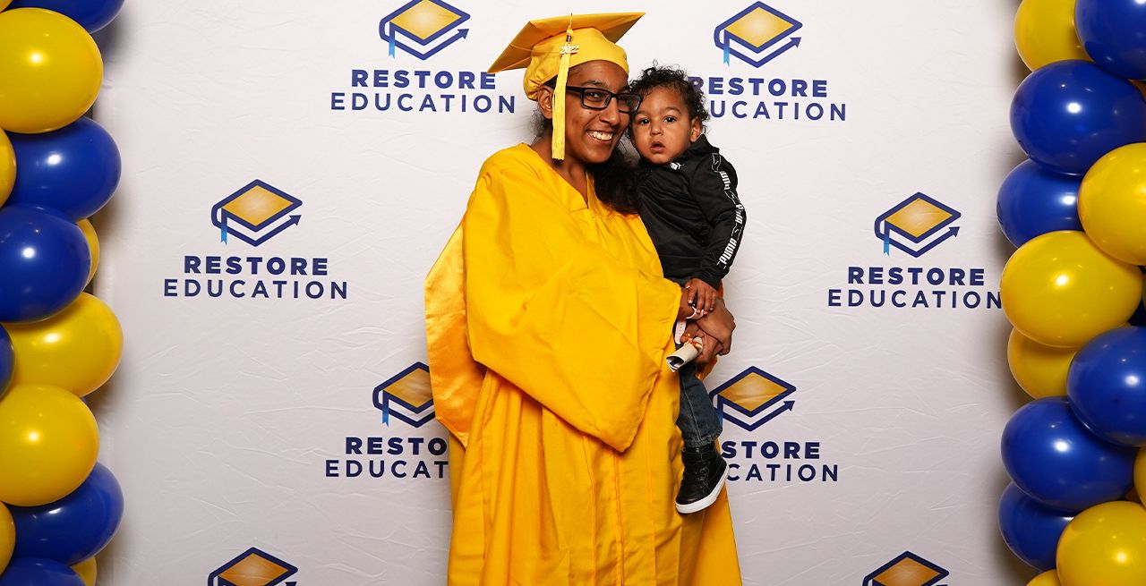 Miquella and her son during her graduation at Restore Education