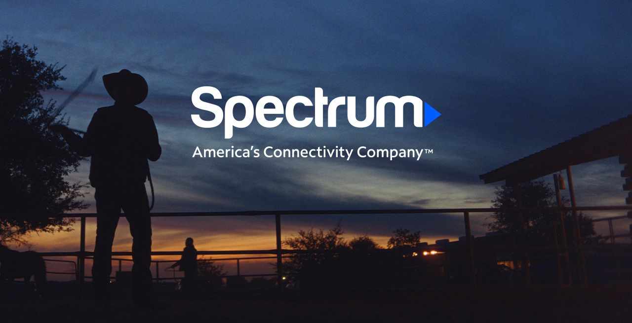 A rancher with sunset and with a logo that reads "Spectrum, America's Connectivity Company"