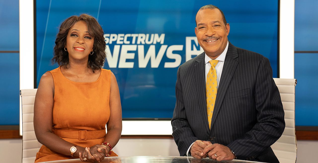 Spectrum News veteran anchors Cheryl Wills and Lewis Dodley in the studio