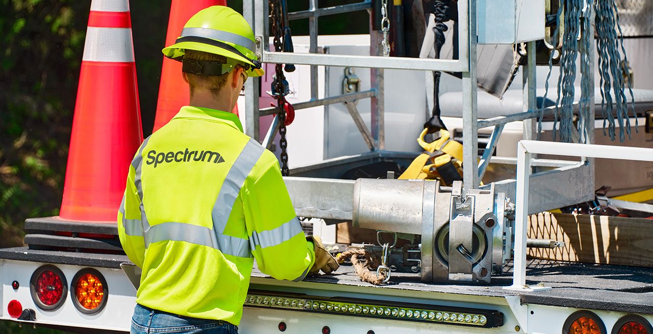 A Spectrum field technician working on a broadband expansion project 