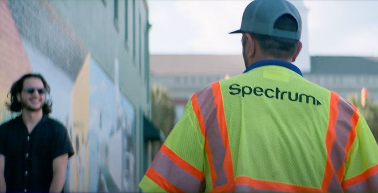 Spectrum technician saying hello to a customer on the street