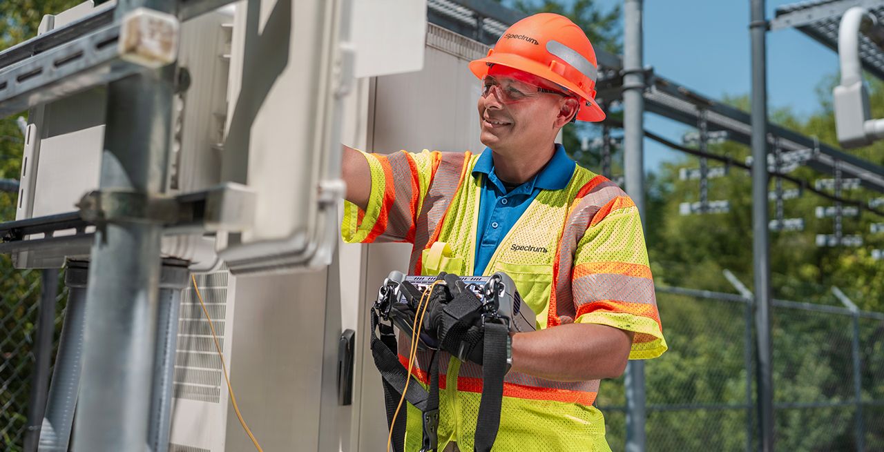 A Spectrum Field Tech VI working on network infrastructure
