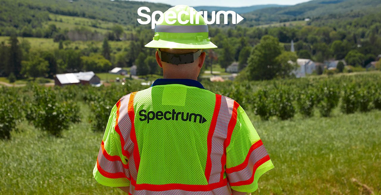 Spectrum technician surveying a rural area for a broadband expansion project