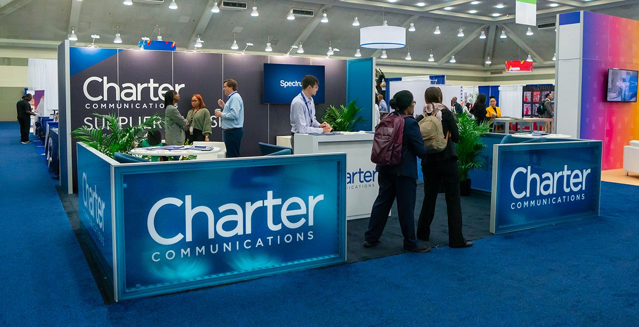 Charter Supplier Diversity booth with attendees at a trade show