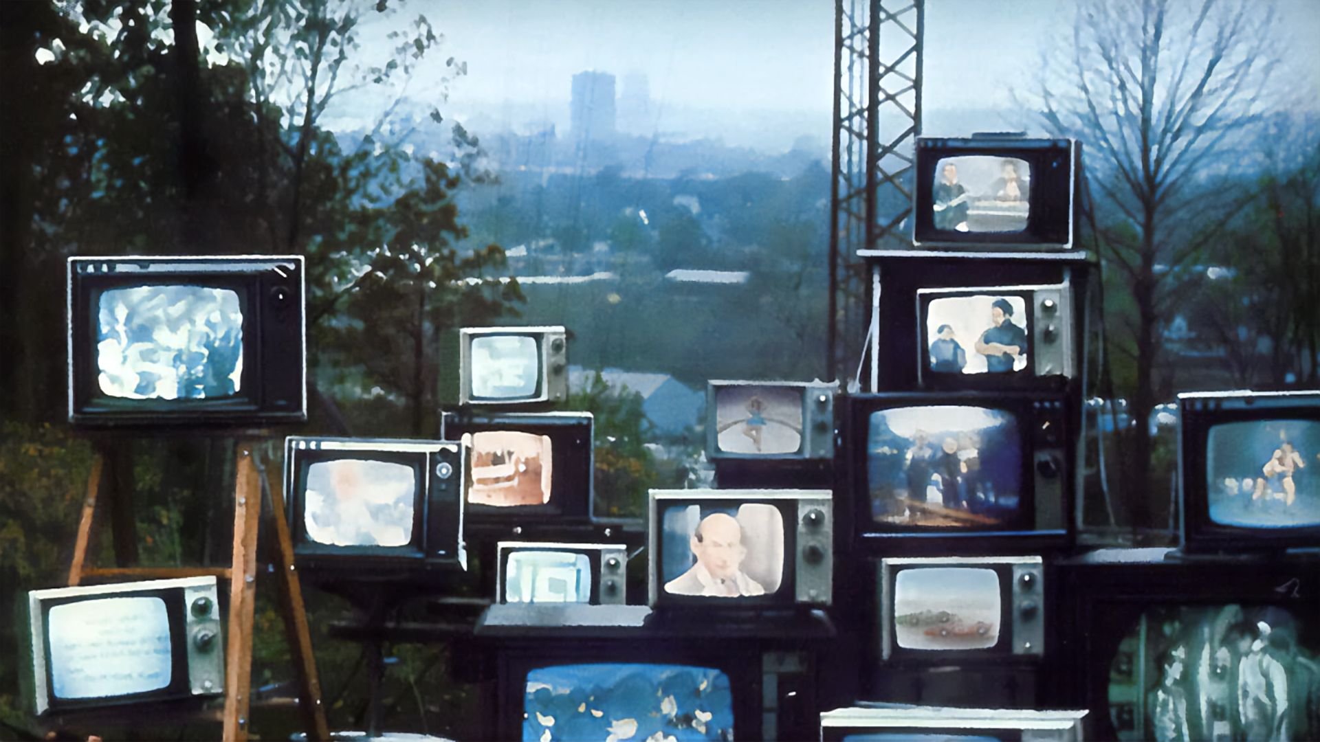 A wall of tv's showing cable programing