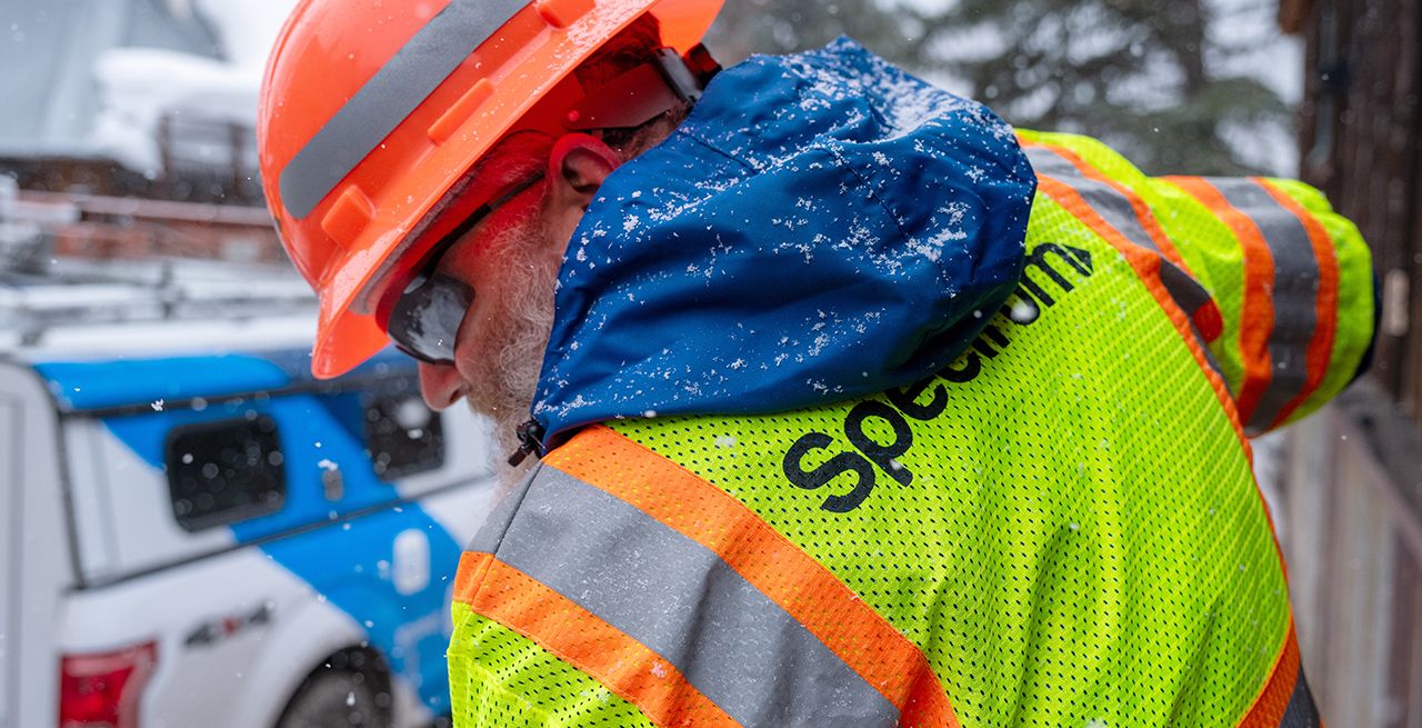 A Spectrum field technician working at a broadband expansion project