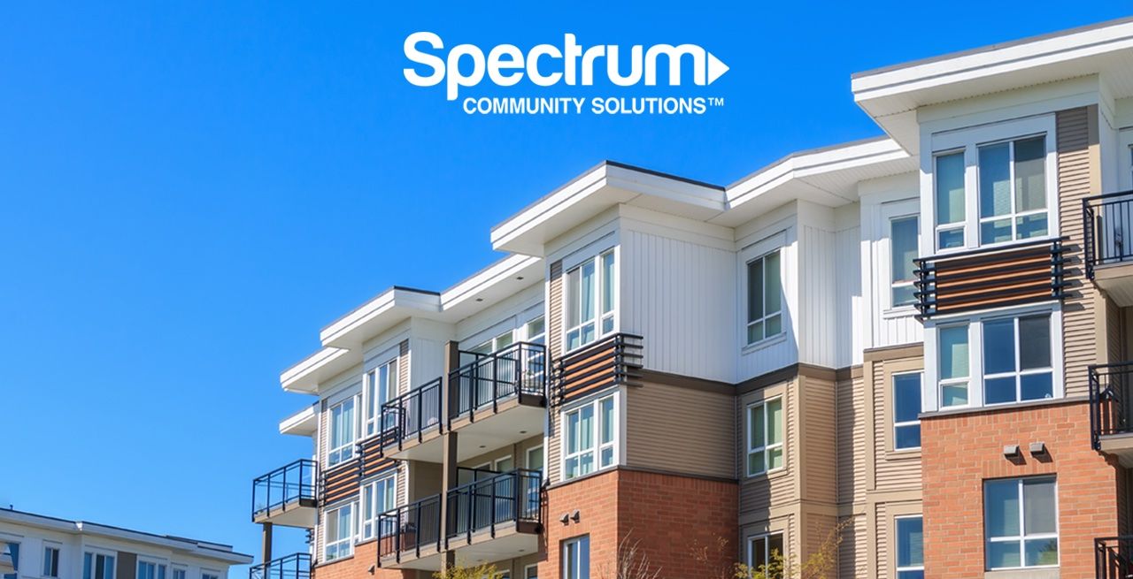 Apartment complex with Spectrum Community Solutions logo