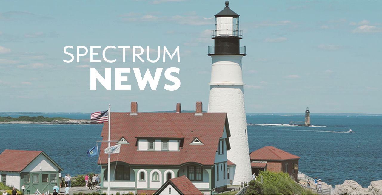 Scenic Maine coastline with lighthouse and Spectrum news logo