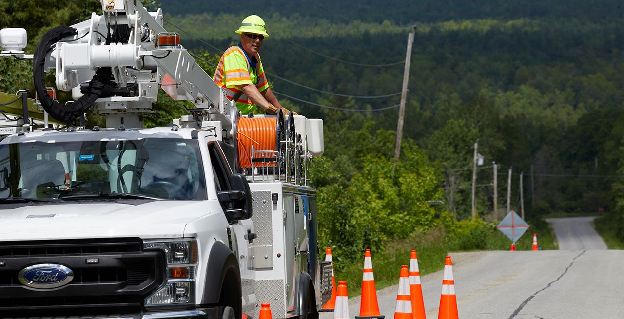 Spectrum technician working on broadband expansion project